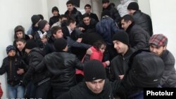 Armenia - Pro-government youths prevent journalists from covering the supposedly public defense of Yerevan Mayor Taron Markarian's doctoral thesis, Yerevan, 26Dec2013.