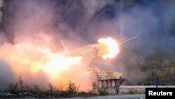 Russia -- A "TOS-1 Buratino" multiple rocket launcher fires during the "Russia Arms Expo 2013" 9th international exhibition of arms, military equipment and ammunition, in the Urals city of Nizhny Tagil, September 25, 2013