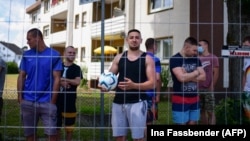 Romanian employees of the Toennies slaughterhouse are seen under quarantine at their residences in the Suerenheide district of Verl on June 22.