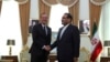 France's top diplomat Emmanuel Bonne shakes hands with Ali Shamkhani, the Secretary of the Supreme National Security Council of Iran in Tehran, Iran July 10, 2019