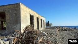 Partly demolished buildings stand on Sochi's waterfront, where new construction is set to begin.