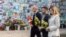 Canadian Prime Minister Mark Carney, Ukrainian President Volodymyr Zelenskyy, and first lade Olena Zelenska attend a flower-laying ceremony at the Memory Wall of Fallen Defenders of Ukraine in Kyiv on August 24.