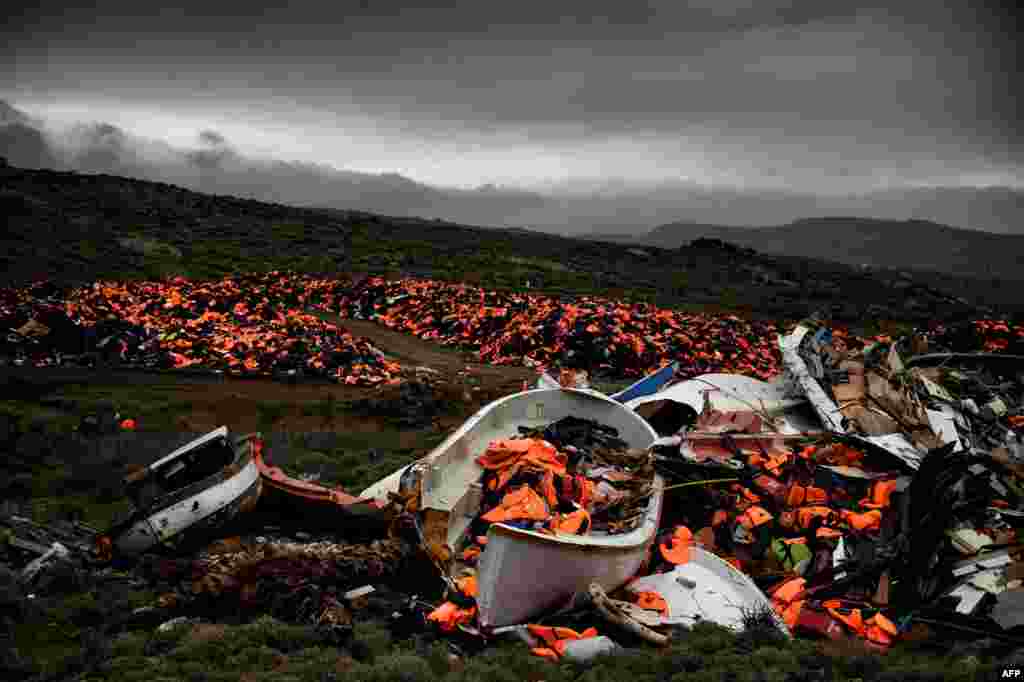 Wrecked boats and thousands of life jackets used by refugees and migrants during their journey across the Aegean Sea lie in a dump in Mithimna, Greece. (AFP/Aris Messinis)