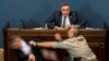 Алеко Элисашвили, который молча наблюдал за дебатами, подошел к трибуне и нанес прямой удар в голову Мамуке Мдинарадзе