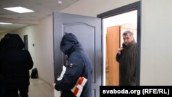 Law enforcement searches the Belarusian Association of Journalists' office in Minsk on February 16.
