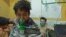 Syrian children and adults receive treatment for a suspected chemical attack at a makeshift clinic in the eastern Ghouta region on the outskirts of Damascus on February 25.