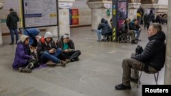 People take shelter inside a metro station during an air raid alert in Kyiv (file photo) 