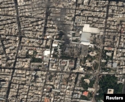 თანამგზავრიდან გადაღებულ ფოტოზე ჩანს შავი კვამლი, რომელიც თეირანში, ირანის უზენაესი ლიდერის დანგრეული რეზიდენციიდან ამოდის. 28 თებერვალი, 2026 წელი