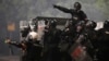 Serbian security forces at an anti-government protest near the Serbian Progressive Party office in Belgrade on August 15 