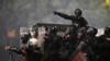 Serbian security forces at an anti-government protest near the Serbian Progressive Party office in Belgrade on August 15 