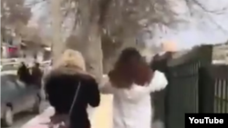 Image grab from a video showing two women in Kangavar, Kermanshah province walking in the street without headscarf. Undated