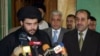 Prime Minister Nuri al-Maliki (right) with Muqtada al-Sadr in April