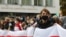 Students attend an opposition rally to reject the presidential election results, near the Belarusian State University in Minsk on October 26, 2020. 