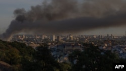 Smoke rises over Kyiv following a Russian air strike on the Ukrainian capital on September 8.