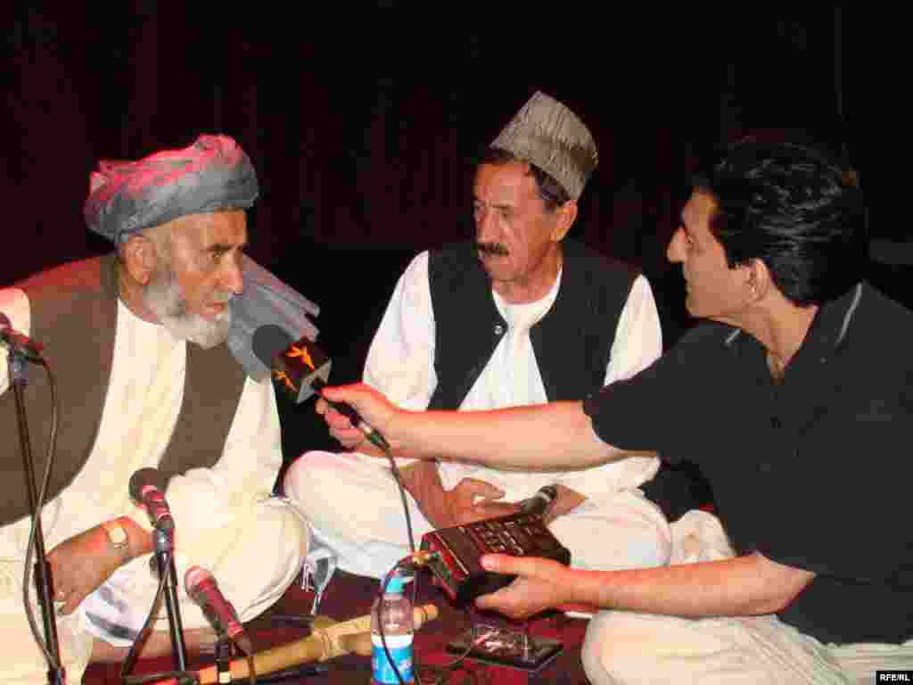 Afghanistan -- Dur Mohammad Keshmi, famous singer ( L ) and Mr. Bahaudin an Afghan musician ( R ) from Badakhshan province of Afghanistan during International Music Festival in Kabul, 24Sep2009 - Kabul.Afghanistan -- Dur Mohammad Keshmi famous singer ( L ) and Mr. Bahaudin an afghan musician ( R ) from Badakhshan province of Afghanistan during International Music Festival in Kabul, 24September2009 