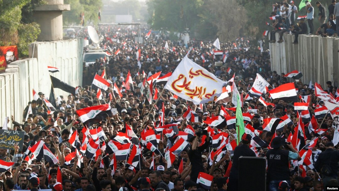 Supporters of Iraqi Shi'ite cleric Muqtada al-Sadr shout slogans during an anti-Turkey protest in front of the Turkish Embassy in Baghdad on October 18.
