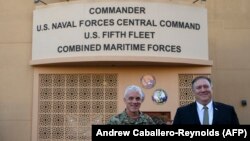 BAHRAIN -- U.S. Secretary of State Mike Pompeo poses for a photo with Vice Admiral James Malloy (L) Commander, US Naval Forces, U.S. Central Command/Commander, US 5th Fleet, Combined Maritime Forces before taking a tour of the U.S. Naval Forces Central Command.