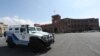 Armenia -- A police vehicle parked outside the Armenian government headquarters at Yerevan's deserted Republic Square, March 25, 2020.