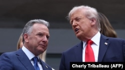 US President Donald Trump (R) speaks with special envoy Steve Witkoff during the US Open tennis tournament in New York, on September 7, 2025.