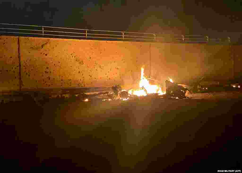 A picture published by Iraqi authorities shows a destroyed vehicle on fire following a U.S. air strike on the road to Baghdad&#39;s international airport, in which top Iranian commander Qasem Soleimani was killed. (AFP)