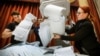 Members of a local electoral commission empty a ballot box at a polling station after the last day of parliamentary elections in Moscow on September 19. 