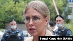 Russian opposition activist Lyubov Sobol speaks to the media as she arrives at a court in Moscow on August 3.