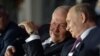 Belarus - Presidents Armen Sarkissian (L) of Armenia and Vladimir Putin of Russia attend the opening ceremony of the European Games in Minsk, June 20, 2019.