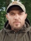 Russian army veteran Alexander Lunin speaks in an unidentified location