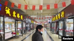 Торговый центр в китайском городе Ухань, который считается местом вспышки коронавируса, распространившегося по всему миру.
