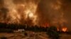 Šumski požar u blizini kuće u selu Kirinthos, na ostrvu Evia, Grčka, 6. augusta 2021. 