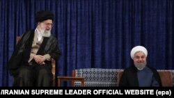 A handout photo made available by the Supreme leader official website shows Iranian president Hassan Rouhani (R) and Iranian supreme leader Ali Khamenei (L) at Rouhani's confirmation ceremony, August 3.