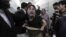 A relative of one of the victims of the attack reacts at a local hospital in Peshawar on February 13.