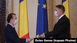 Florin Citu (left) meets with President Klaus Iohannis on December 23.