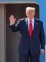US President Donald Trump waves at the top of the stairs of Air Force One as he arrives at Kuala Lumpur International Airport in Sepang on October 26, 2025.