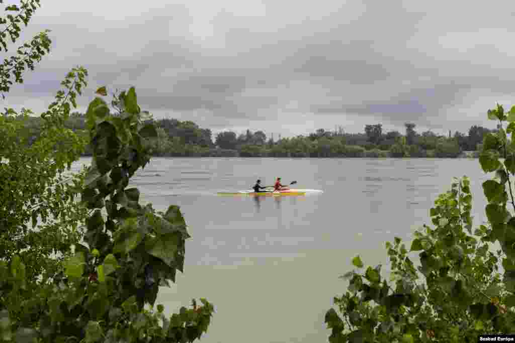 While Hungarians brace for flooding, some residents take to the rising waters for kayaking.