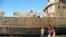 Kazakh children play on an abandoned ship in the dry bed of the Aral Sea.