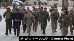 FILE: Gen. Austin S. Miller US army commander in Afghanistan during meeting with the governor of Ghazni Province in November.