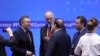 Syrian U.N. ambassador Bashar al-Jaafari (C) speaks with other participants during a session of the peace talks on Syria in Nur-Sultan, April 26, 2019