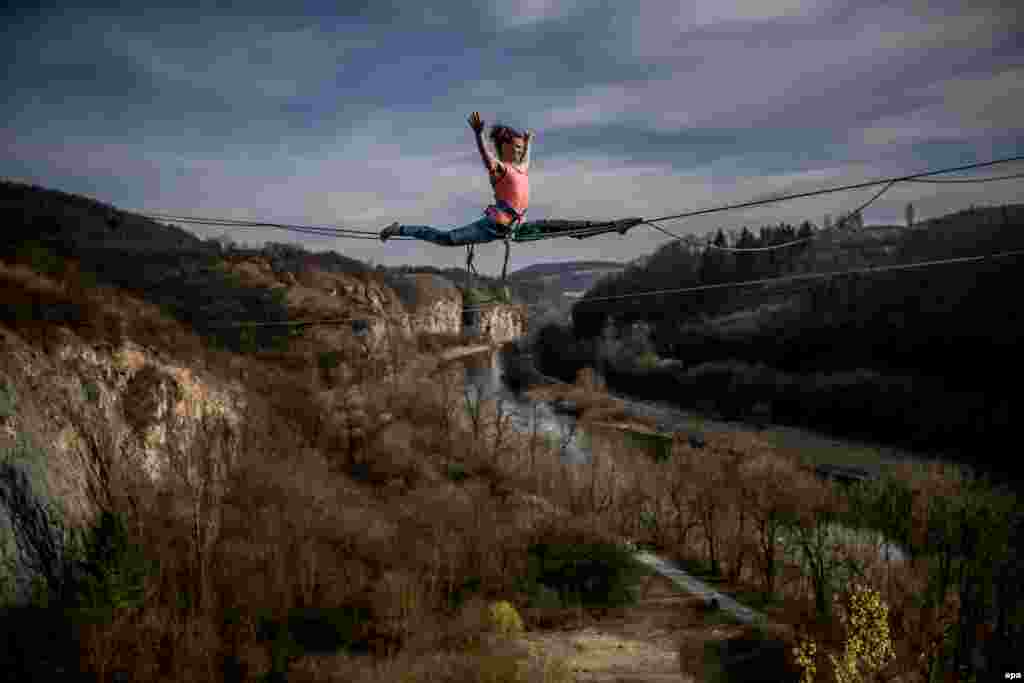 A woman takes part in a highline event in a former quarry, near the village of Srbsko in the Czech Republic.&nbsp;(epa/Martin Divisek)