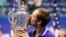 Russian tennis star Daniil Medvedev kisses the championship trophy after defeating Serbia's Novak Djokovic in the men's singles final of the U.S. Open on September 12, 2021, in New York City.