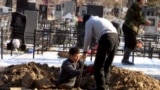 Kyrgyzstan - The digging a grave, South-West Cemetery In Bishkek, 23Jan2012