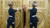 Honor guards open the doors for Russian President Vladimir Putin followed by Crimean leaders entering the hall for the signing ceremony of a treaty for Crimea to join Russia in the Kremlin in March 2014. 