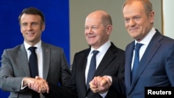 Francuski predsjednik Emmanuel Macron (s lijeva nadesno), njemački kancelar Olaf Scholz i poljski premijer Donald Tusk u Berlinu, mart 2024.