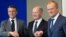 French President Emmanuel Macron (left to right), German Chancellor Olaf Scholz, and Polish Prime Minister Donald Tusk shake hands at a previous meeting of the Weimar Triangle at the Chancellery in Berlin.
