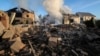 Firefighters work at the site of a Russian missile strike in Kharkiv on May 10.