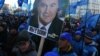 "We are with you" says the sign under the photograph of Ukrainian President Viktor Yanukovych at a pro-government rally in Kyiv on December 14.