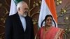 Indian Foreign Minister Sushma Swaraj (right) poses for photos with Iranian Foreign Minister Mohammad Javad Zarif prior to a meeting in New Delhi on May 14. 