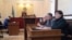 Заседание суда в Астане об условно-досрочном освобождении Ержана Утембаева. Справа налево: активист Маржан Аспандиярова, Рысбек Сарсенбайулы и Толеген Жукеев. Астана, 7 ноября 2014 года.