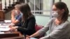 Svetlana Prokopyeva (right) attends a court hearing in Pskov on June 22.