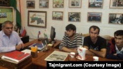 Karomat Sharipov (left) meets with three Tajiks released from slavery in 2014. (Photo: Tajmigrant.com)